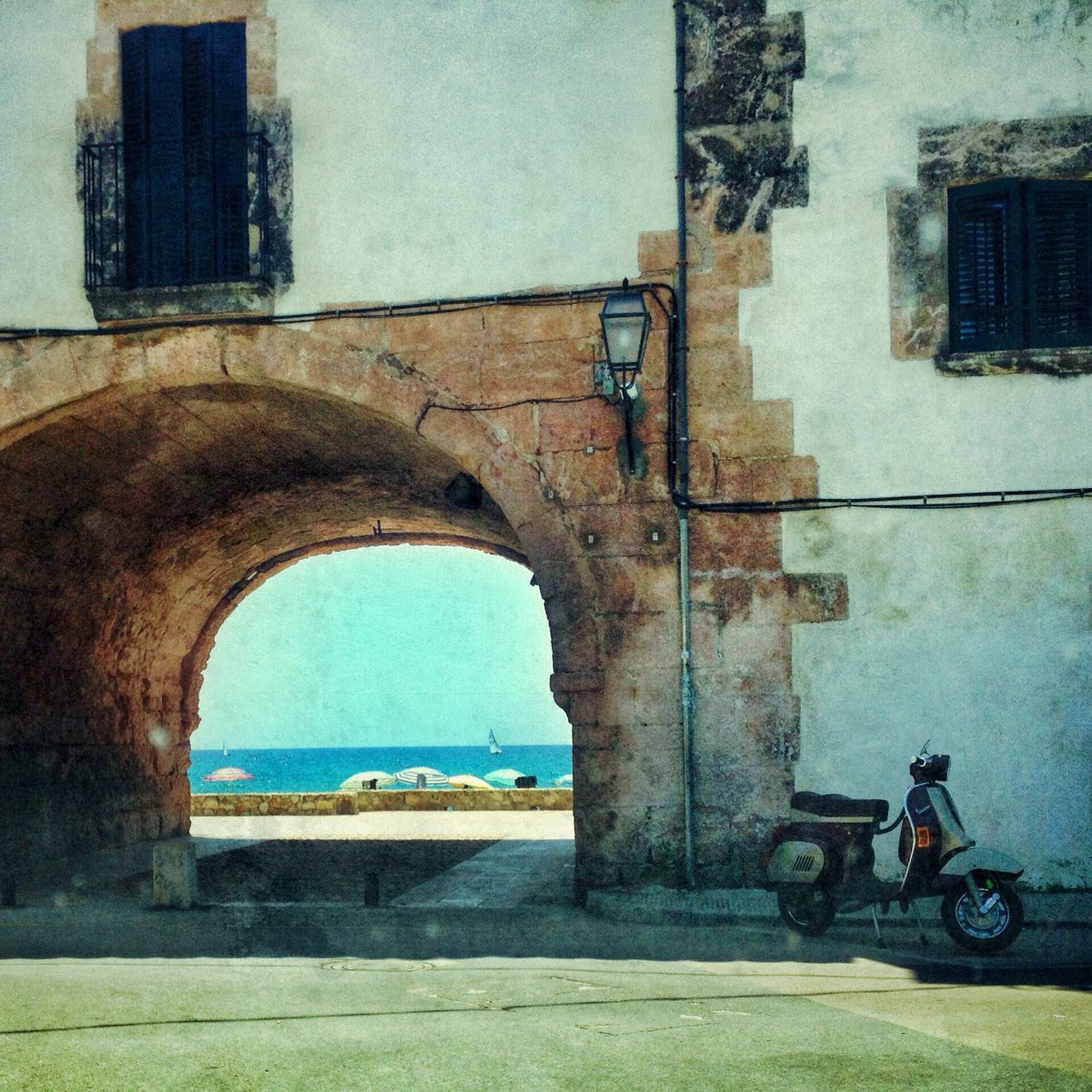 architecture, building exterior, built structure, window, building, land vehicle, transportation, mode of transport, house, arch, day, old, residential structure, residential building, car, abandoned, wall - building feature, blue, outdoors, sky