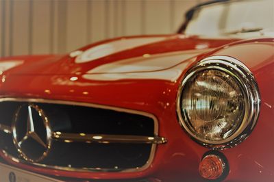 Close-up of red vintage car