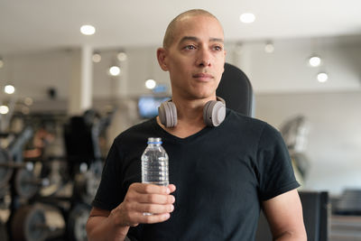 Young man drinking glass