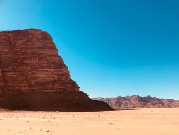 Rock formations in desert against clear sky