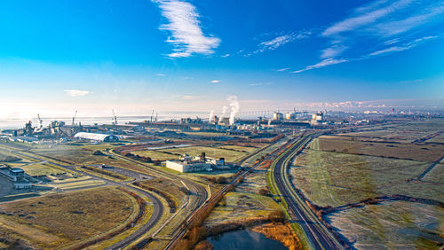 High angle view of cityscape against blue sky