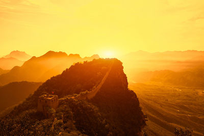 Scenic view of mountains against sky during sunset