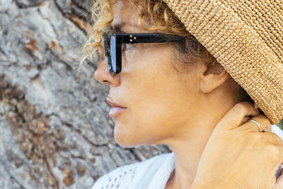 Close-up of young woman wearing hat