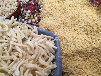 High angle view of raw pastas on table
