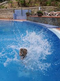 Swimming underwater in pool