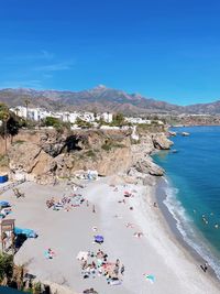 Scenic view of beach against clear blue sky