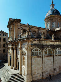 Low angle view of historic building against clear sky