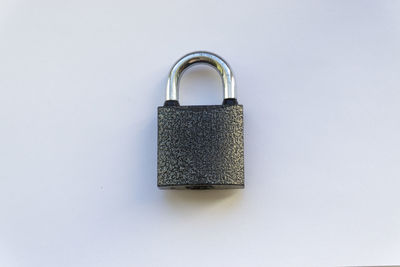 High angle view of padlock on white background