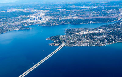 High angle view of city by sea