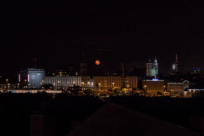 Illuminated buildings in city at night