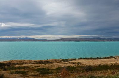 Scenic view of lake and mountain against sky