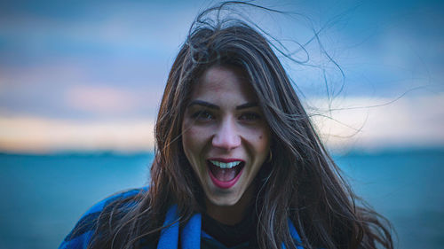 Portrait of woman against water