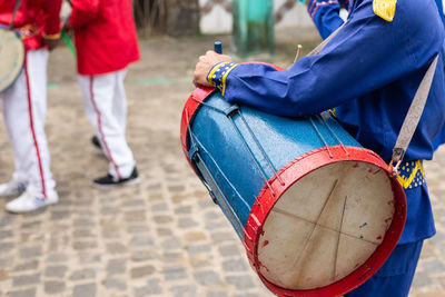 Members of the marujada and cheganca cultural group are seen playing percussion instruments 