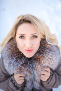 Portrait of a beautiful young woman in winter