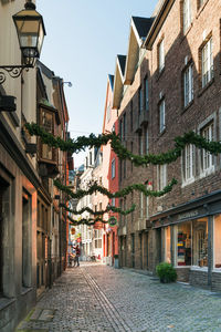 Narrow street amidst buildings in town