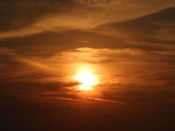 Low angle view of dramatic sky during sunset