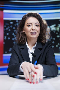 Portrait of young woman using mobile phone