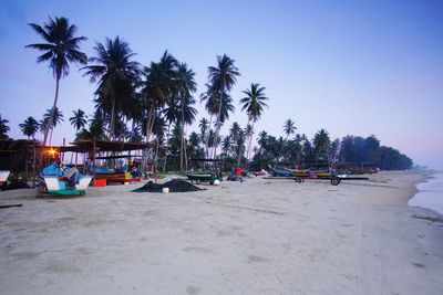 Panoramic view of people on beach against sky