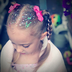 Close-up portrait of cute girl looking away