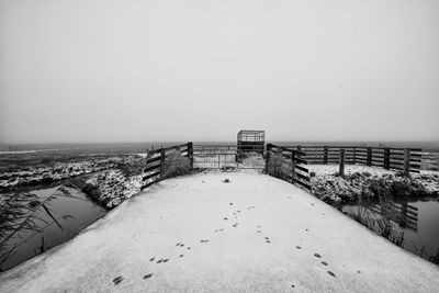 Scenic view of sea against sky during winter