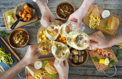 High angle view of people having food on table