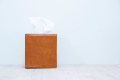 Close-up of empty table against white background