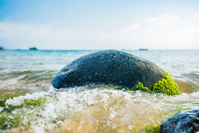 Close-up of sea waves against sky