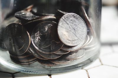 Close-up of coins on table