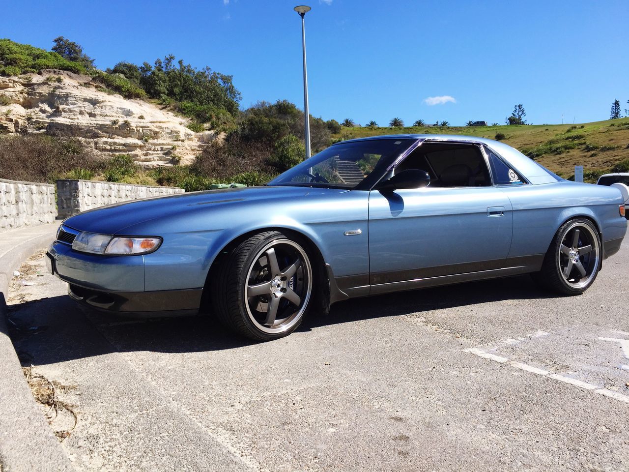 car, blue, transportation, land vehicle, tree, day, no people, outdoors, sky