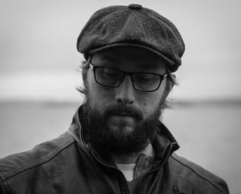 Close-up of mature man wearing flat cap while standing outdoors