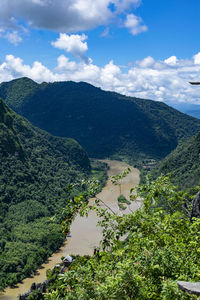 High angle view of trees and mountains against sky