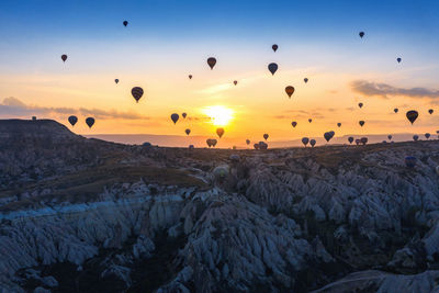 View of hot air balloons at sunset