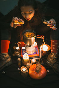 Portrait of woman having food on table