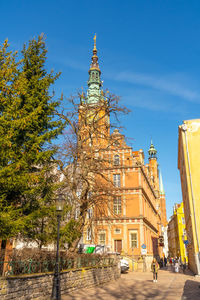 Low angle view of buildings against clear blue sky