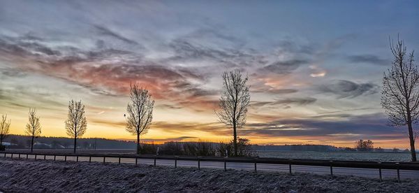 Scenic view of field against sky during sunset