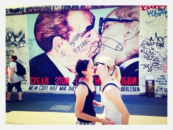 Close-up of woman standing on wall