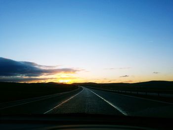 Highway seen through car windshield