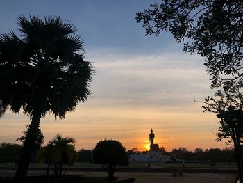 Low angle view of silhouette trees against sky during sunset