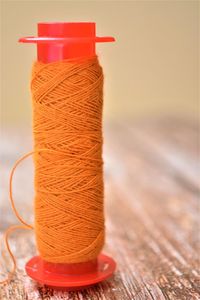 Close-up of red bell on table