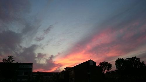 Low angle view of cloudy sky at sunset