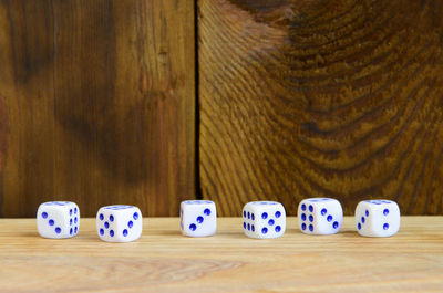 High angle view of multi colored dice on table