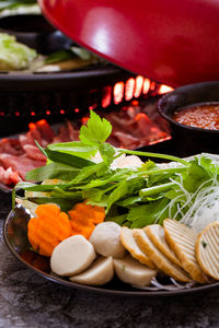 High angle view of chopped vegetables in bowl on table