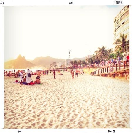 large group of people, beach, clear sky, sea, mixed age range, sand, person, men, lifestyles, water, leisure activity, vacations, copy space, tourist, shore, transfer print, built structure, tourism, architecture