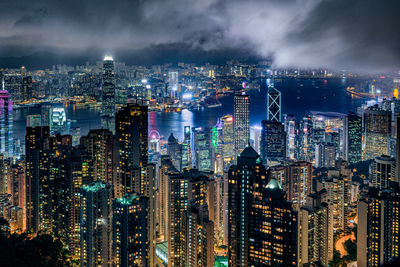 High angle view of illuminated city buildings at night