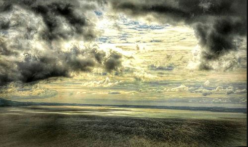 Scenic view of sea against cloudy sky