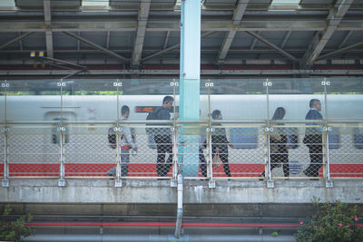 Group of people looking at railway station