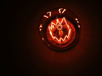 Low angle view of illuminated light bulb