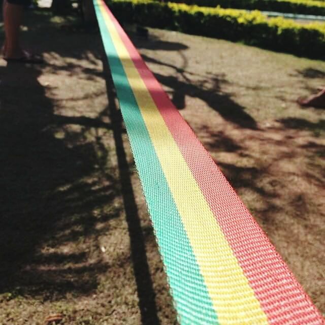 MULTI COLORED SHADOW ON ASPHALT