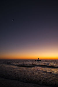 Scenic view of sea against clear sky during sunset