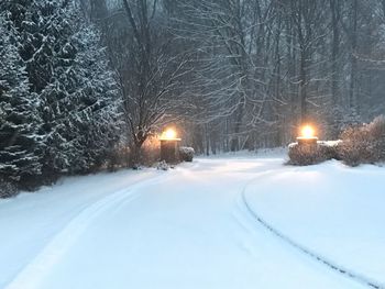 Snow covered road at night